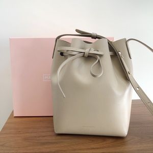 mansur gavriel mini bucket bag in sand.